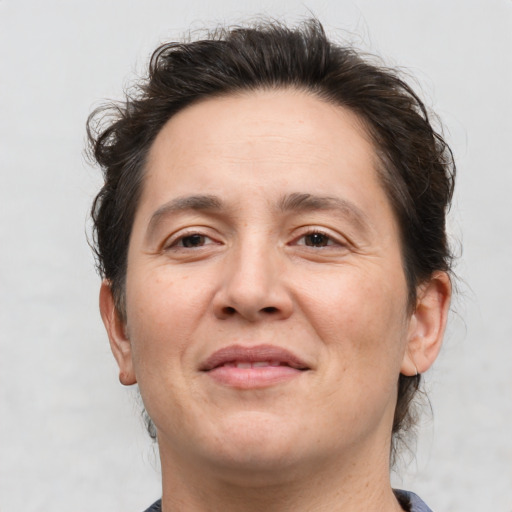 Joyful white adult male with medium  brown hair and brown eyes