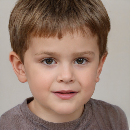 Joyful white child male with short  brown hair and brown eyes