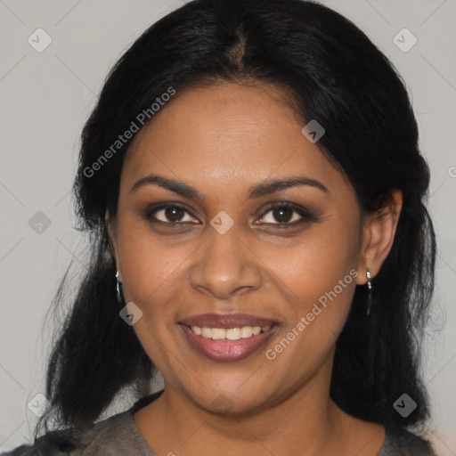 Joyful black adult female with medium  black hair and brown eyes