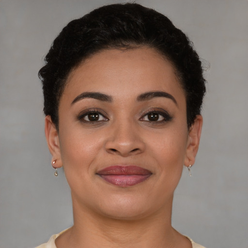 Joyful latino young-adult female with short  brown hair and brown eyes