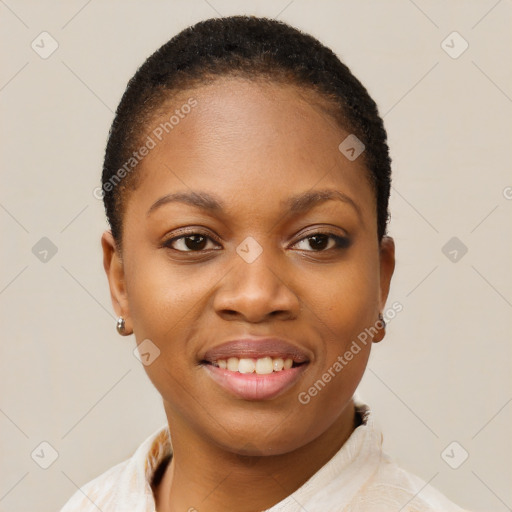 Joyful black young-adult female with short  brown hair and brown eyes