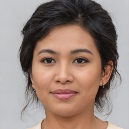 Joyful asian young-adult female with medium  brown hair and brown eyes