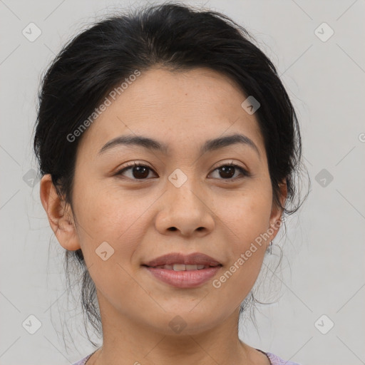 Joyful asian adult female with medium  brown hair and brown eyes