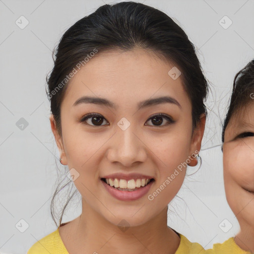 Joyful asian young-adult female with medium  brown hair and brown eyes