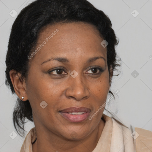 Joyful black adult female with medium  brown hair and brown eyes