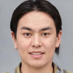 Joyful white young-adult male with medium  brown hair and brown eyes