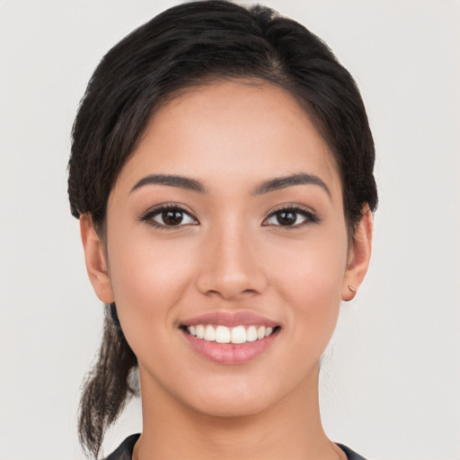 Joyful white young-adult female with medium  brown hair and brown eyes