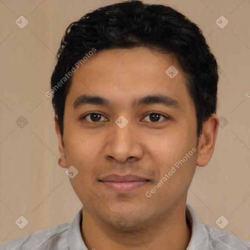 Joyful latino young-adult male with short  black hair and brown eyes