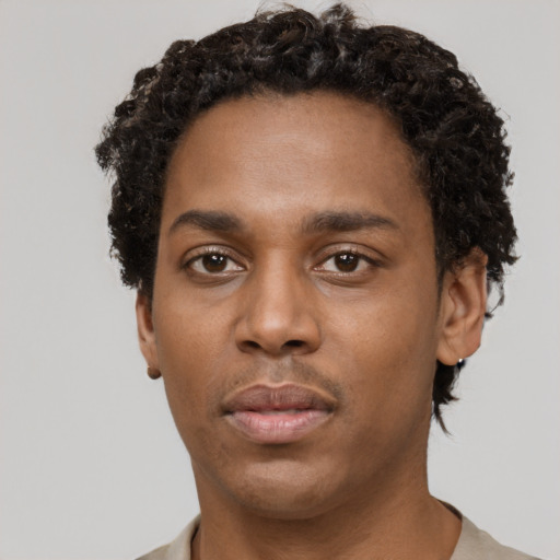 Neutral black young-adult male with short  brown hair and brown eyes