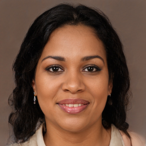 Joyful latino young-adult female with medium  black hair and brown eyes