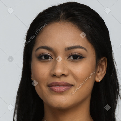 Joyful latino young-adult female with long  brown hair and brown eyes