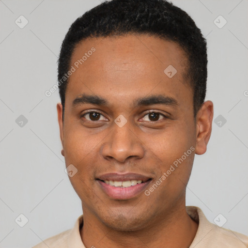 Joyful black young-adult male with short  black hair and brown eyes