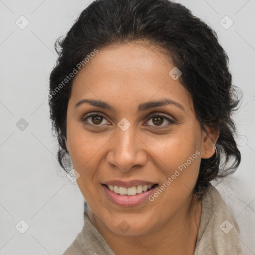 Joyful latino young-adult female with long  brown hair and brown eyes