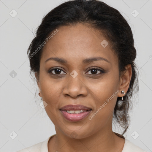 Joyful black young-adult female with medium  brown hair and brown eyes