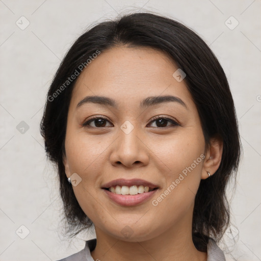 Joyful asian young-adult female with medium  brown hair and brown eyes