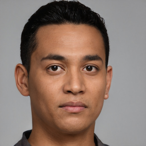 Neutral latino young-adult male with short  black hair and brown eyes