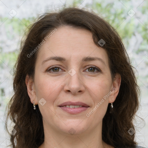 Joyful white adult female with long  brown hair and grey eyes