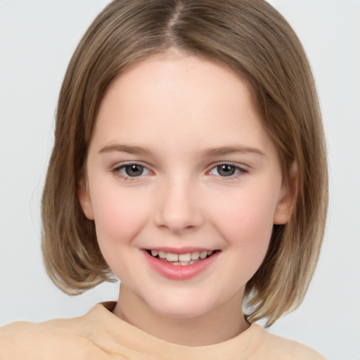 Joyful white child female with medium  brown hair and brown eyes