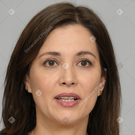 Joyful white adult female with medium  brown hair and brown eyes