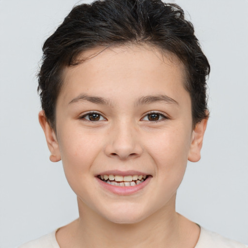 Joyful white child female with short  brown hair and brown eyes