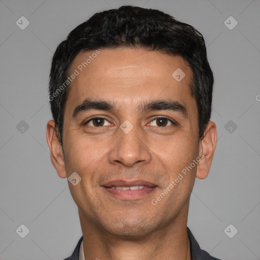 Joyful white young-adult male with short  black hair and brown eyes