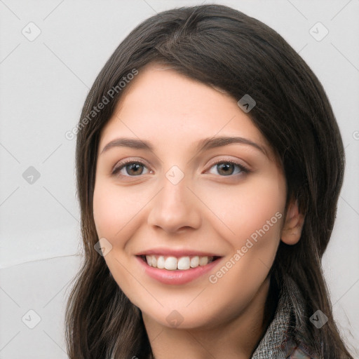 Joyful white young-adult female with long  brown hair and brown eyes