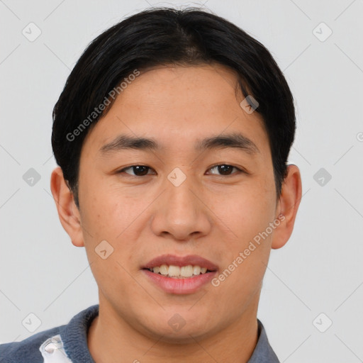 Joyful asian young-adult male with short  brown hair and brown eyes