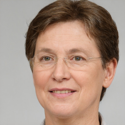 Joyful white middle-aged female with short  brown hair and grey eyes