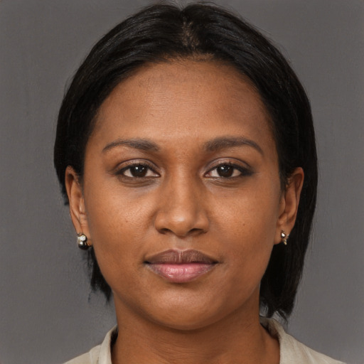 Joyful black young-adult female with medium  brown hair and brown eyes