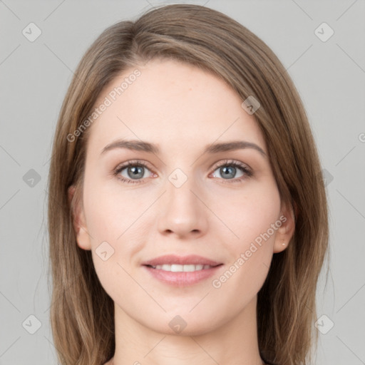 Joyful white young-adult female with long  brown hair and green eyes