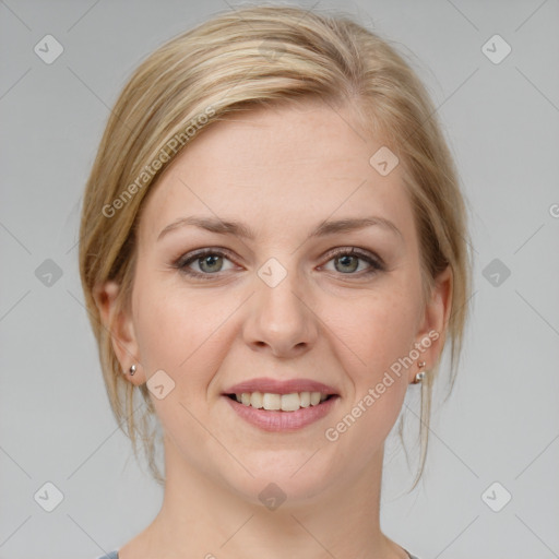 Joyful white young-adult female with medium  brown hair and grey eyes