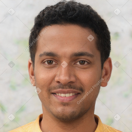 Joyful latino young-adult male with short  black hair and brown eyes