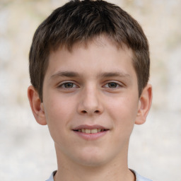 Joyful white child male with short  brown hair and brown eyes