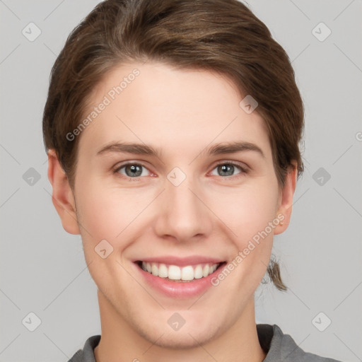 Joyful white young-adult female with short  brown hair and grey eyes