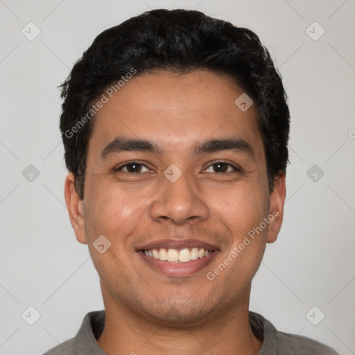 Joyful latino young-adult male with short  black hair and brown eyes