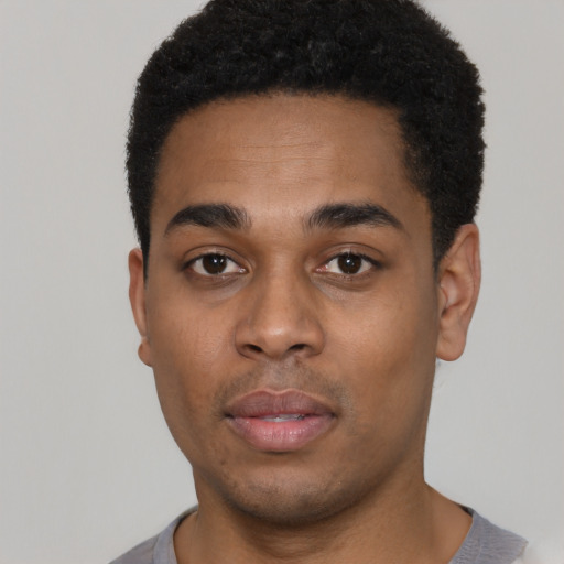 Neutral black young-adult male with short  black hair and brown eyes