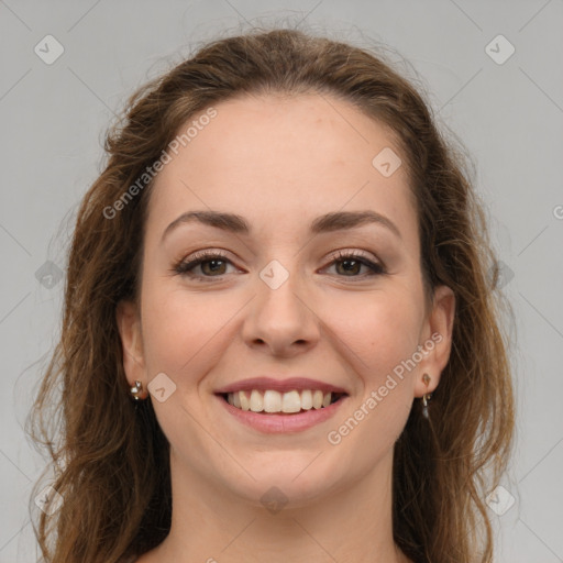 Joyful white young-adult female with long  brown hair and green eyes