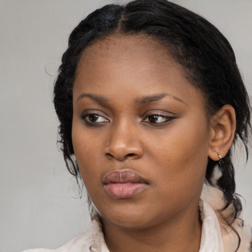 Neutral black young-adult female with medium  black hair and brown eyes