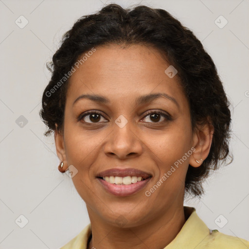 Joyful latino adult female with short  brown hair and brown eyes