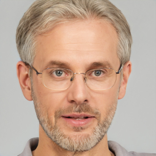 Neutral white middle-aged male with short  blond hair and brown eyes