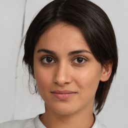 Joyful white young-adult female with medium  brown hair and brown eyes