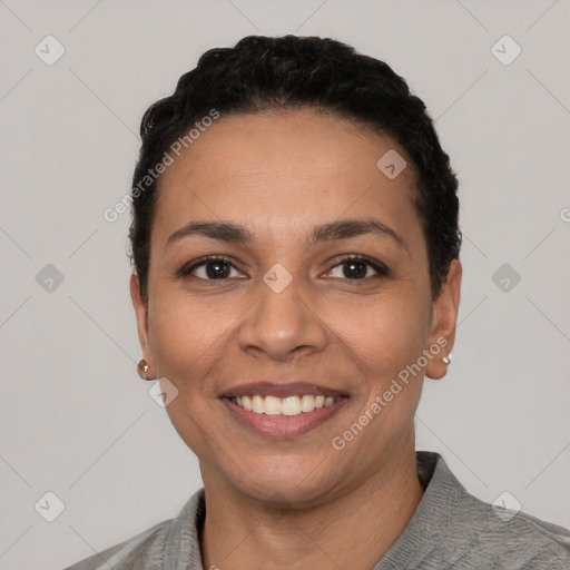 Joyful latino young-adult female with short  black hair and brown eyes