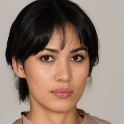 Neutral asian young-adult female with medium  brown hair and brown eyes