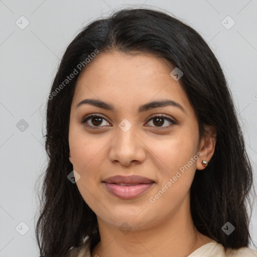 Joyful latino young-adult female with long  brown hair and brown eyes