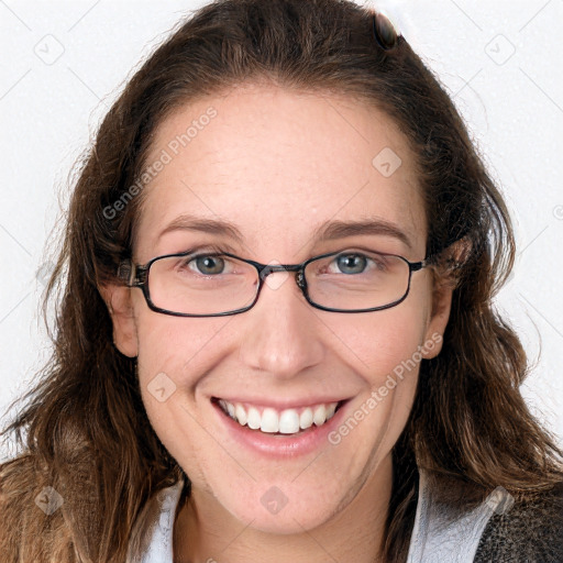 Joyful white young-adult female with long  brown hair and blue eyes