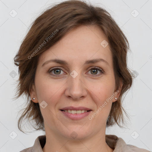 Joyful white adult female with medium  brown hair and grey eyes