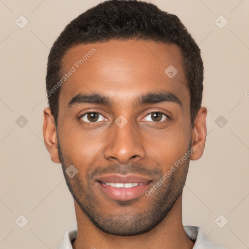 Joyful black young-adult male with short  brown hair and brown eyes