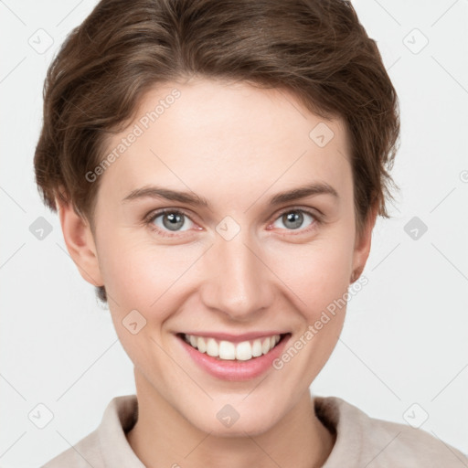 Joyful white young-adult female with short  brown hair and grey eyes