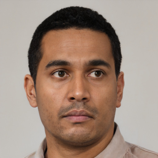 Neutral latino young-adult male with short  black hair and brown eyes
