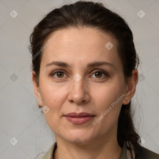 Joyful white adult female with medium  brown hair and grey eyes